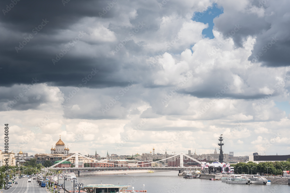 Amazing view of cathedral christ the savior and river, bridge, blue cloudy sky and people on a background. Moscow, Russia Amazing view of cathedral christ the savior and river, bridge, blue cloudy sky and people on a background. Moscow, Russia