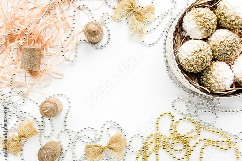  happy holidays and frame made of christmas decoration with christmas balls, tinsel, bow, christmas wallpaper. flat lay, top view
