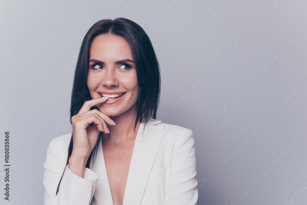 Close up portrait of caucasian excited confident attractive gorgeous stunning charming lovely cute lady, standing on pure light background, grinning, her fingers gently touch her mouth Close up portrait of caucasian excited confident attractive gorgeous stunning charming lovely cute lady, standing on pure light background, grinning, her fingers gently touch her mouth