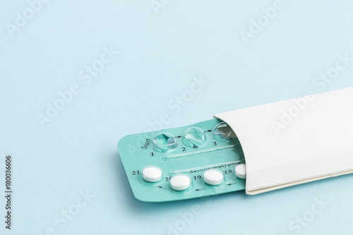 Contraception pills on blue background. Birth control