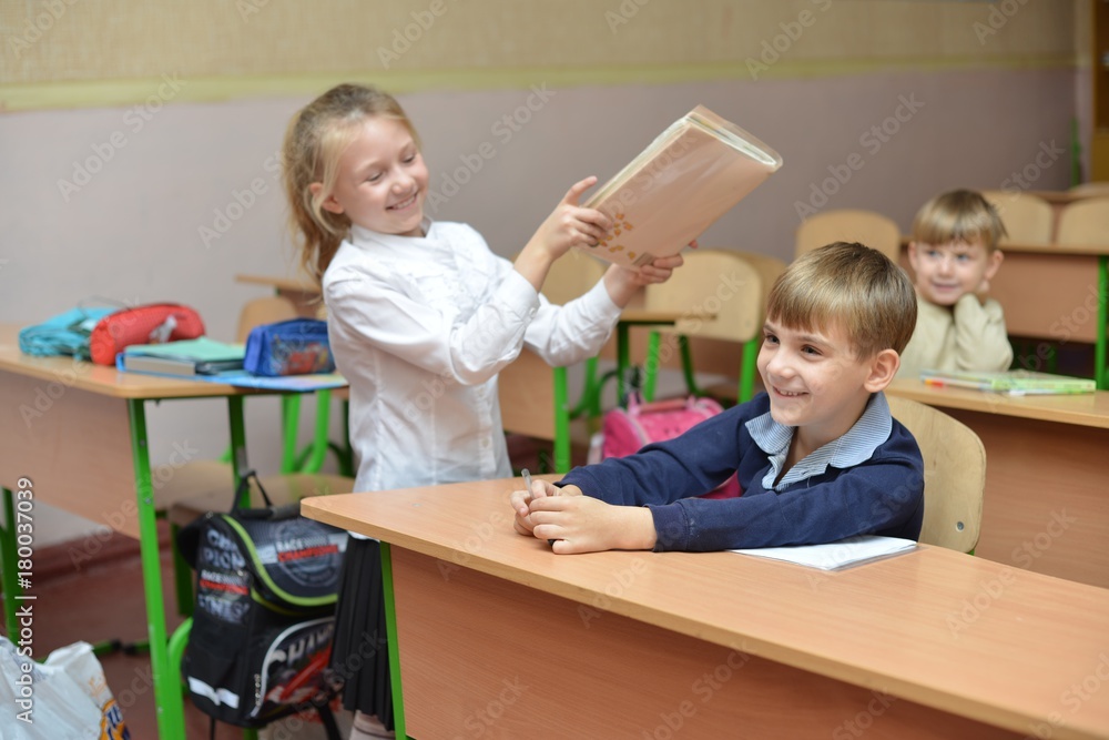 education, children, technology, science and people concept - group of happy kids building robots and making high five gesture at robotics school education, children, technology, science and people concept - group of happy kids building robots and making high five gesture at robotics school