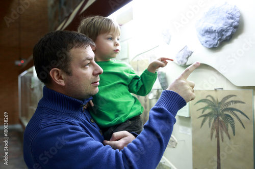 Father with son in museum photo