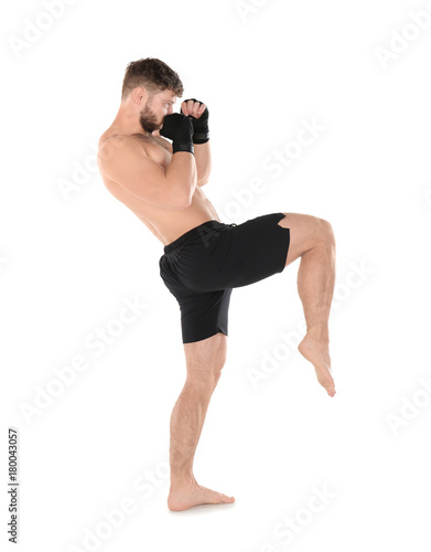 Male kickboxer on white bac...