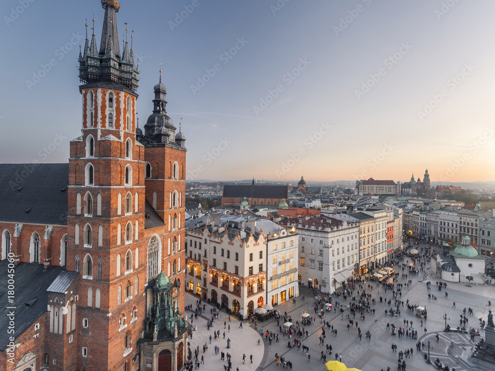 Aerial view of old city center view in Krakow at sunset time, main square, famous cathedral in evening light - obrazy, fototapety, plakaty 