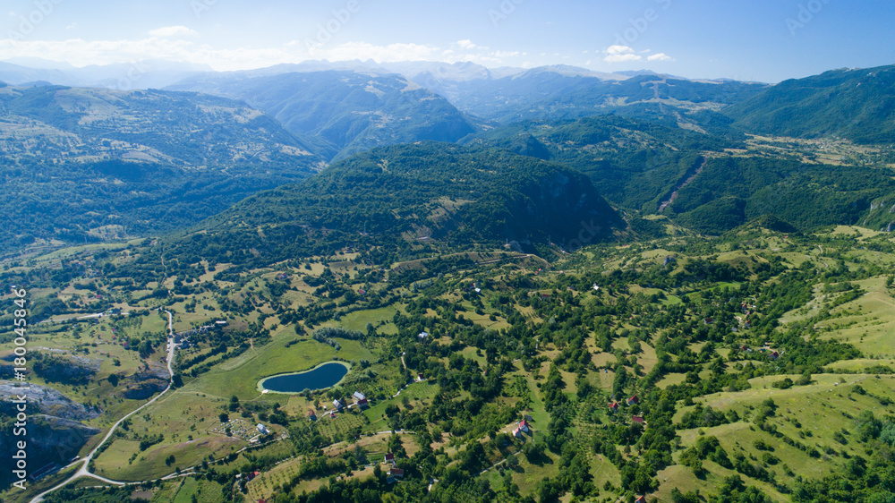 Aerial view Komarnica river canyon and the road to Zabljak