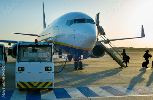 Passengers leave airplane at airport