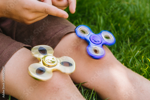 Two spinner in the child's hands photo