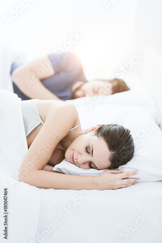 Couple sleeping in bed