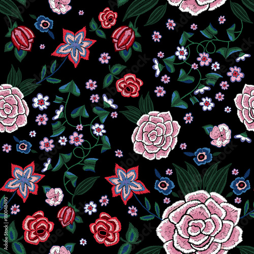 Embroidery ethnic seamless pattern with simplify flowers.