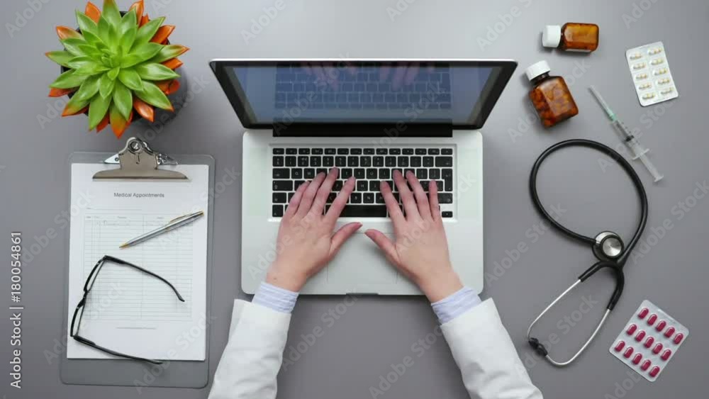 Timelapse Shot Of Female Doctor Using Laptop At Table Timelapse Shot Of Female Doctor Using Laptop At Table