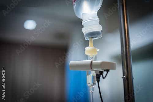 Close up saline solution drip for patient and infusion pump in hospital, Treatment of the disease of the doctor concept.