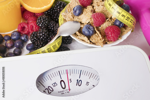 scales with healthy food and tape measure, diet and slimming concept