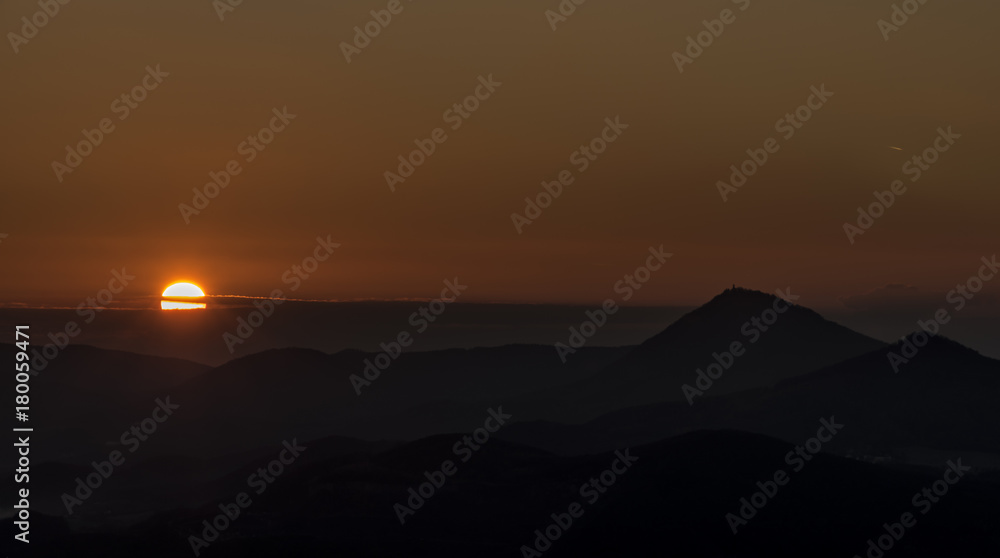 Sunset evening on Varhost hill in Ceske Stredohori mountains Sunset evening on Varhost hill in Ceske Stredohori mountains