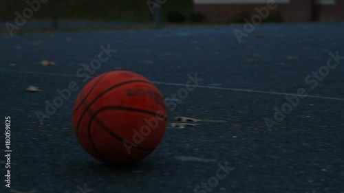 Basketball Rolling Across Screen