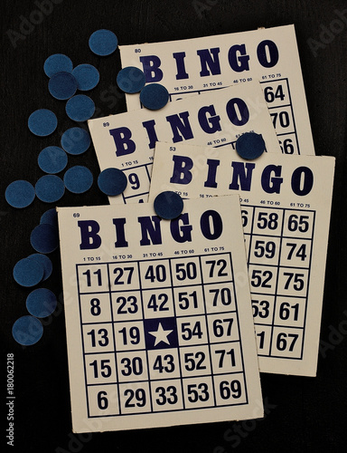 Bingo game cards, four with blue ink