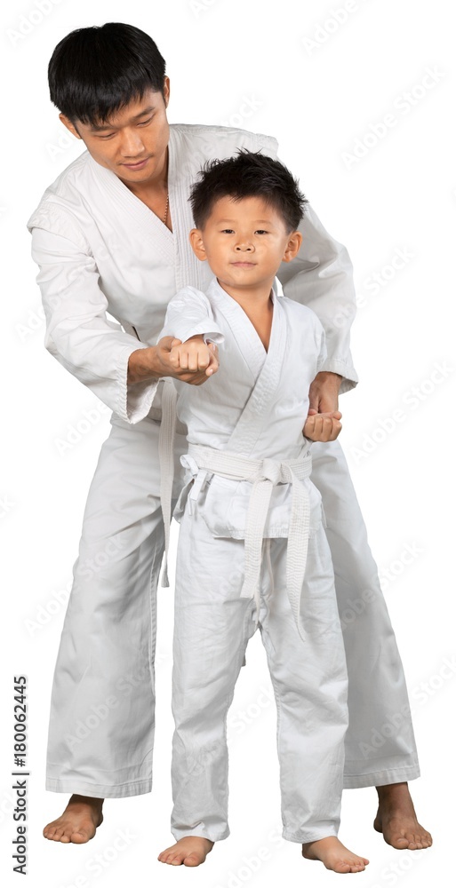 Asian Little Karate Boy and hid Teacher in White Kimono Asian Little Karate Boy and hid Teacher in White Kimono