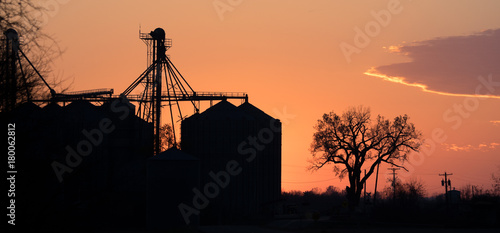 Sunset behind Silo Complex on Farm