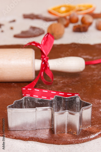 Cookie cutters, rolling pin and ingredients for baking gingerbread, Christmas time concept