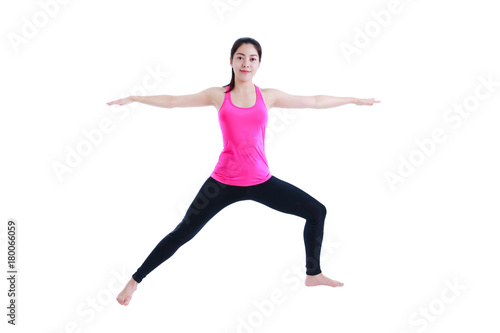 Happy woman doing yoga in warrior pose. Isolated on white background.