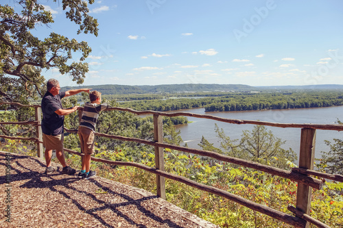People standing at a scenic overlook on the Mississippi River © soupstock