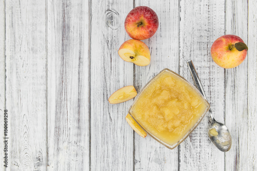 Old wooden table with fresh made Applesauce Old wooden table with fresh made Applesauce