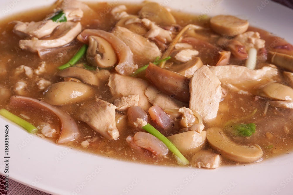 mushroom , pork and dried squid fried with oyster sauce mushroom , pork and dried squid fried with oyster sauce