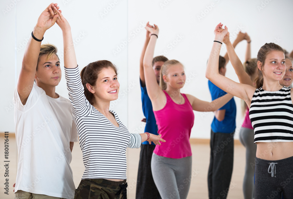 Fototapeta premium Portrait of smiling teenagers at dance school