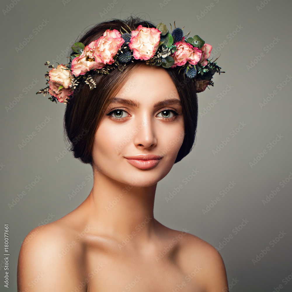 Naklejka premium Young Healthy Woman with Flowers. Spa Model, Skincare and Cosmetology Concept