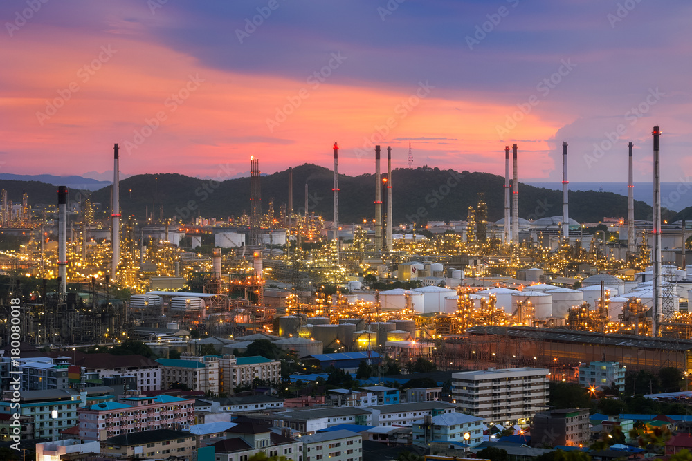 Aerial view Oil refinery with a background of mountains and sky.