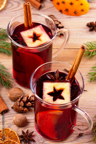 Mulled wine with spices and ingredients, vertical