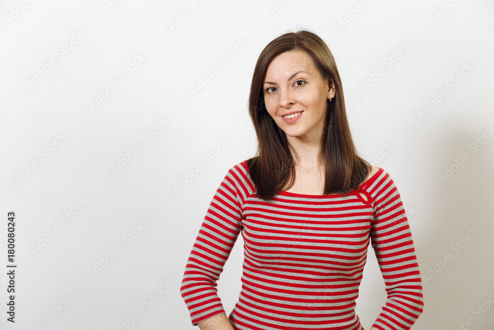 Gorgeous European young happy brown-haired woman with healthy clean skin and charming smile, dressed in casual red and grey clothes, laughing and enjoying on a white background. Emotions concept. Gorgeous European young happy brown-haired woman with healthy clean skin and charming smile, dressed in casual red and grey clothes, laughing and enjoying on a white background. Emotions concept.