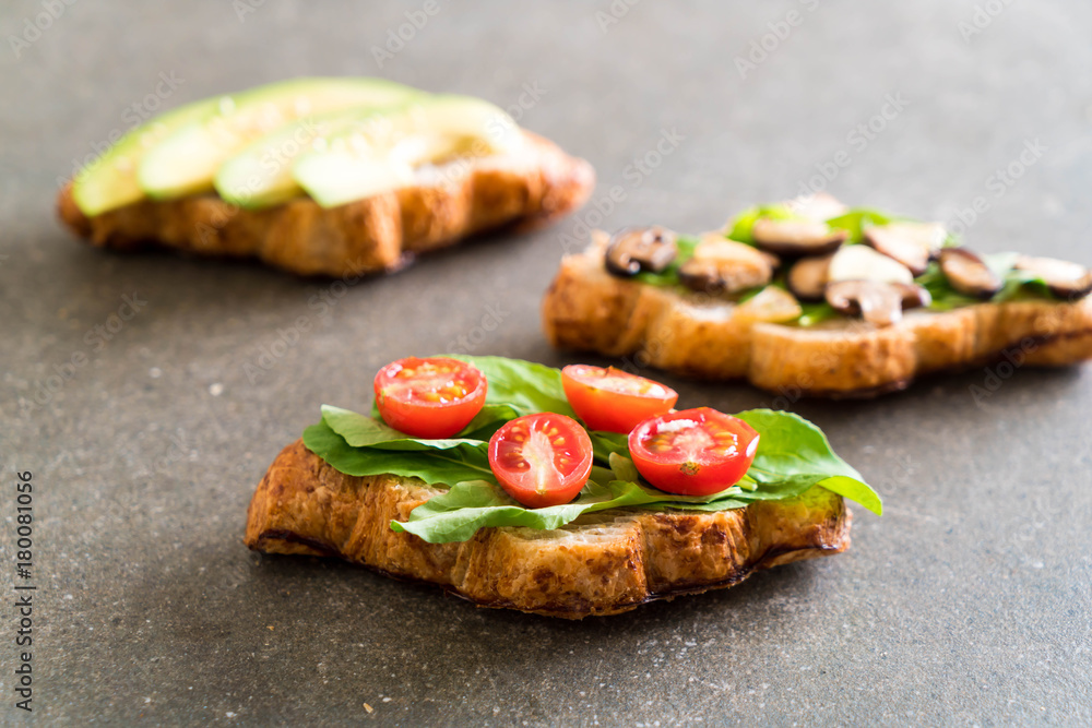 croissant sandwich with avocado, tomatoes and mushroom croissant sandwich with avocado, tomatoes and mushroom