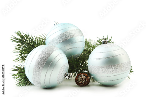 Christmas baubles with fir-tree branch isolated on white background
