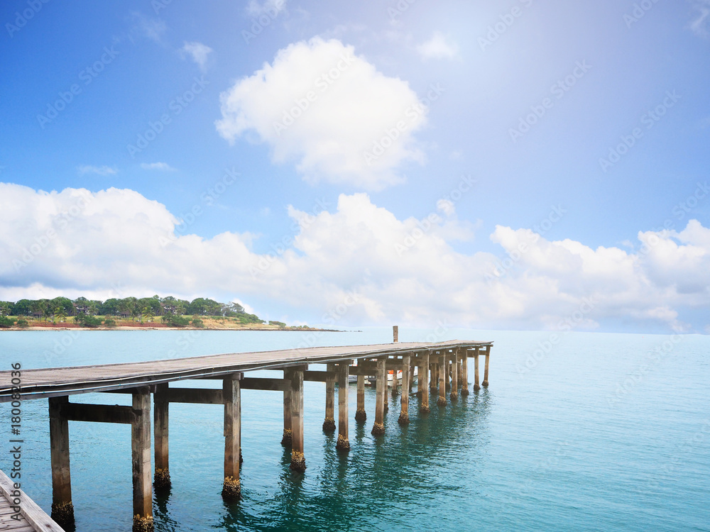 Wooden bridge in the blue sea and blue sky landscape in Thailand