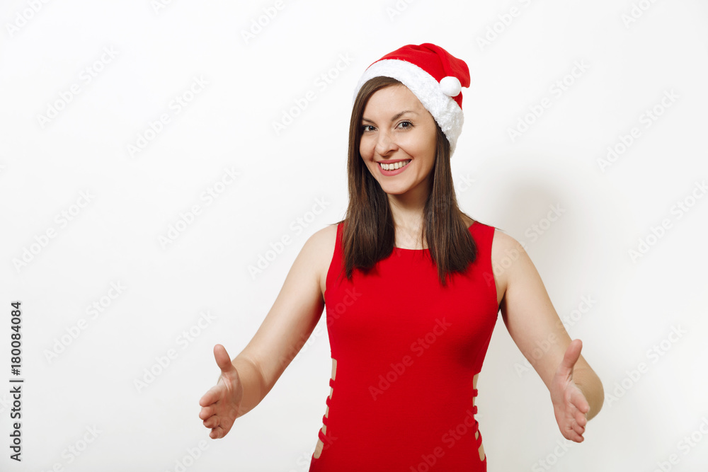 Pretty caucasian happy woman wearing red dress and Christmas hat holding copy space between palms for advertisement or text on white background. Santa girl isolated. New Year holiday 2018 concept Pretty caucasian happy woman wearing red dress and Christmas hat holding copy space between palms for advertisement or text on white background. Santa girl isolated. New Year holiday 2018 concept