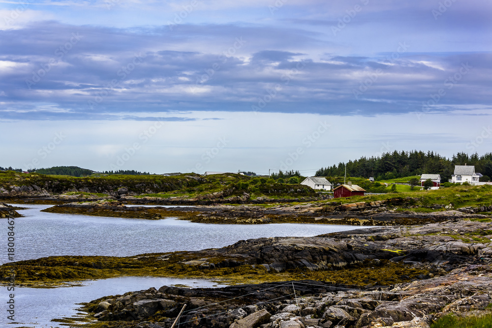 A calming Ocean Vista with a gorgeous cloudscape and rocky island formations in the background and tide pools in the foreground. A calming Ocean Vista with a gorgeous cloudscape and rocky island formations in the background and tide pools in the foreground.