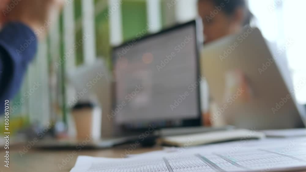 Young Programmer Man Finished His Work on Computer and Puts On Glasses on Table in Office. 4K, Slowmotion. Young Programmer Man Finished His Work on Computer and Puts On Glasses on Table in Office. 4K, Slowmotion.