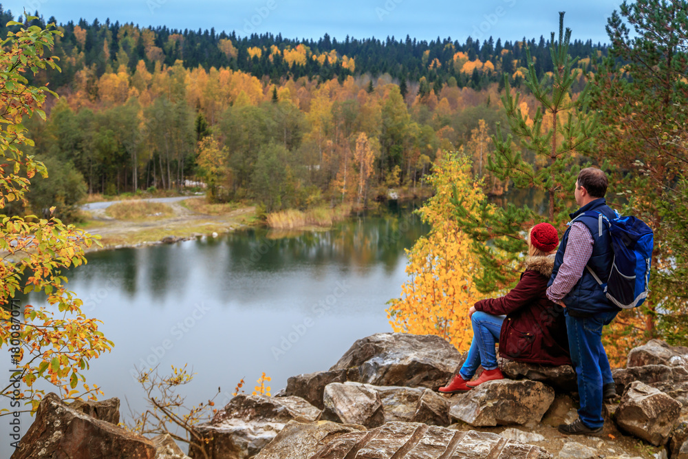 Family travelers looking at a mountain lake in Marble Canyon. Family travelers looking at a mountain lake in Marble Canyon.