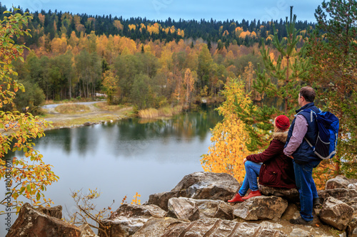 Family travelers looking at a mountain lake in Marble Canyon.