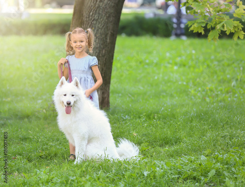 Cute little girl with dog i...