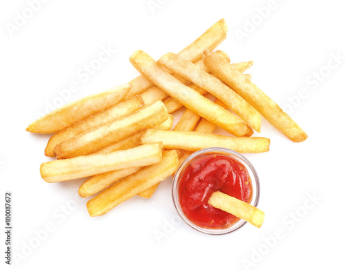 Yummy french fries with sauce on white background