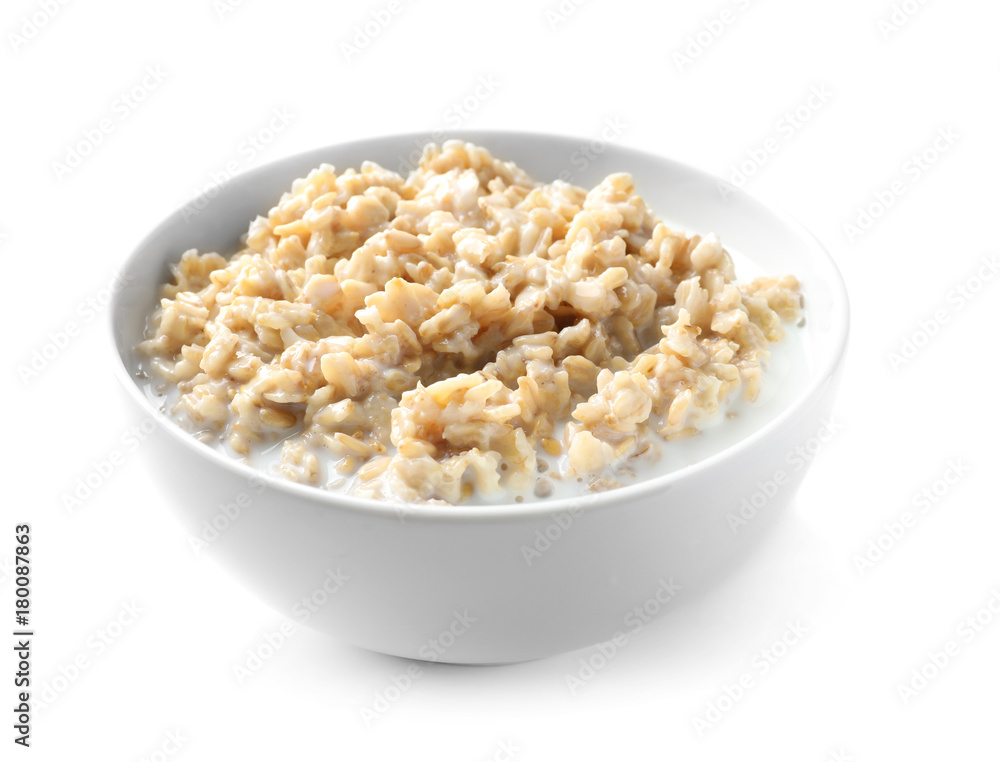 Bowl with yummy oatmeal against white background Bowl with yummy oatmeal against white background