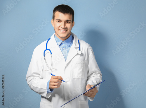 Young male doctor with clip...