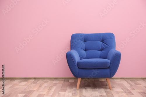 Fotografie, Obraz Blue armchair near color wall