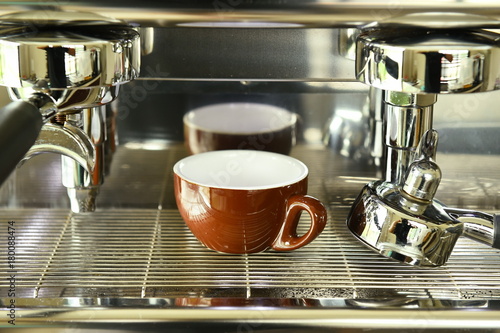 close up of coffee machine preparing cup of coffee