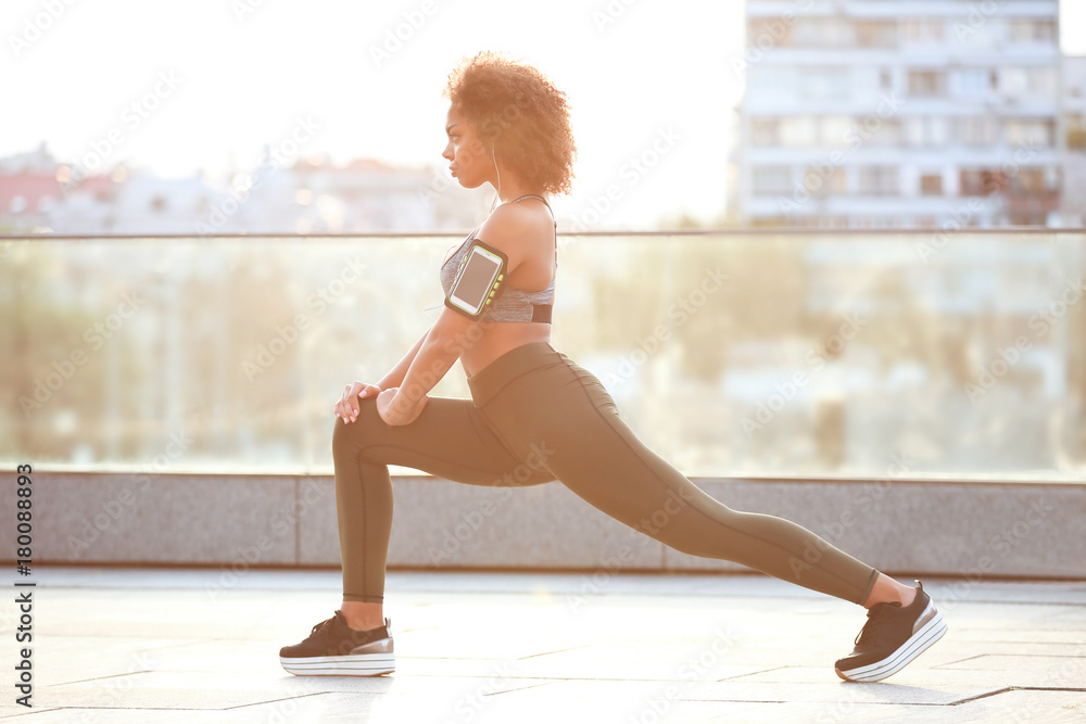 Sporty African American woman training outdoors Sporty African American woman training outdoors