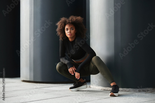 Принти на полотні Beautiful African American woman in sportswear outdoors