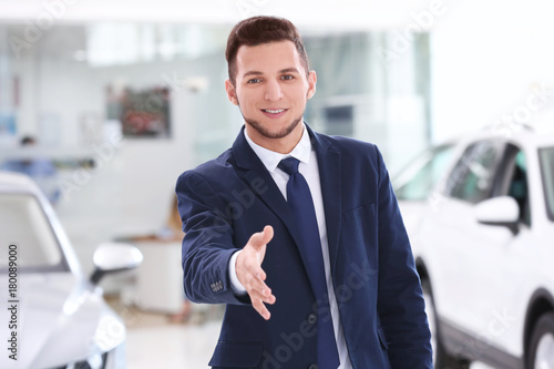 Car salesman in dealership