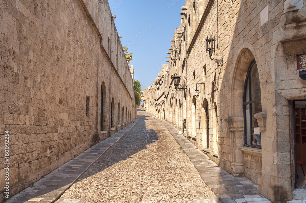 Old castle architecture building street with big wall in Rhodes Greek town