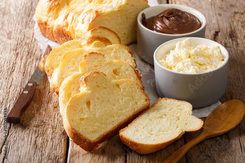 Homemade brioche bread and mascarpone cheese, chocolate cream close-up. horizontal